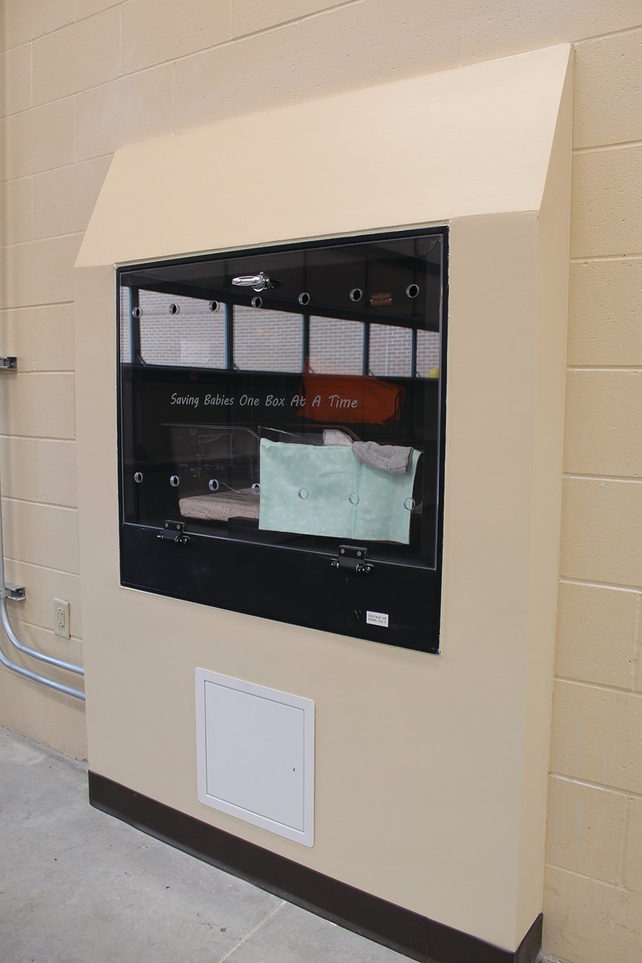 The interior of the new Safe Haven baby box at Franciscan Health Crawfordsville features a clear cover and a constant temperature between 75 and 79 degrees, as well as blankets and other child products designed to make a baby comfortable.